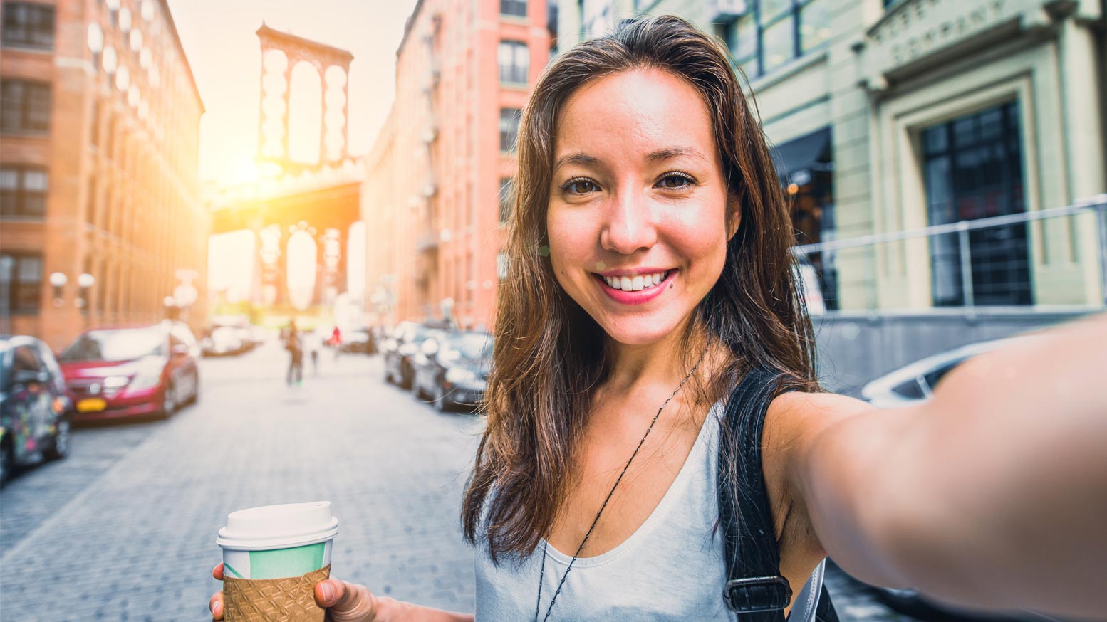 Woman having a selfie with a coffee cup